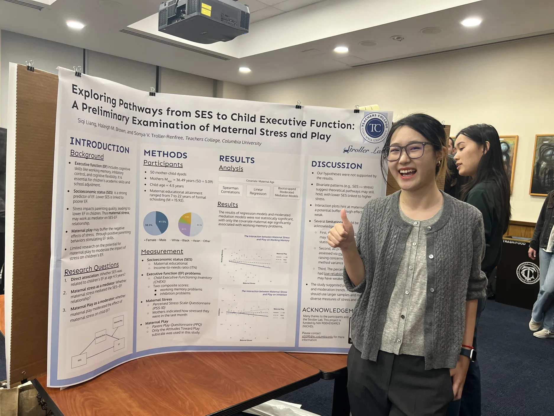Siqi in front of her poster