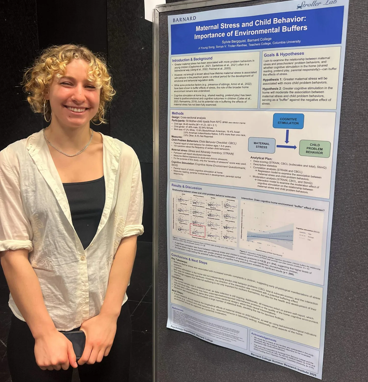 Sylvie in front of her poster